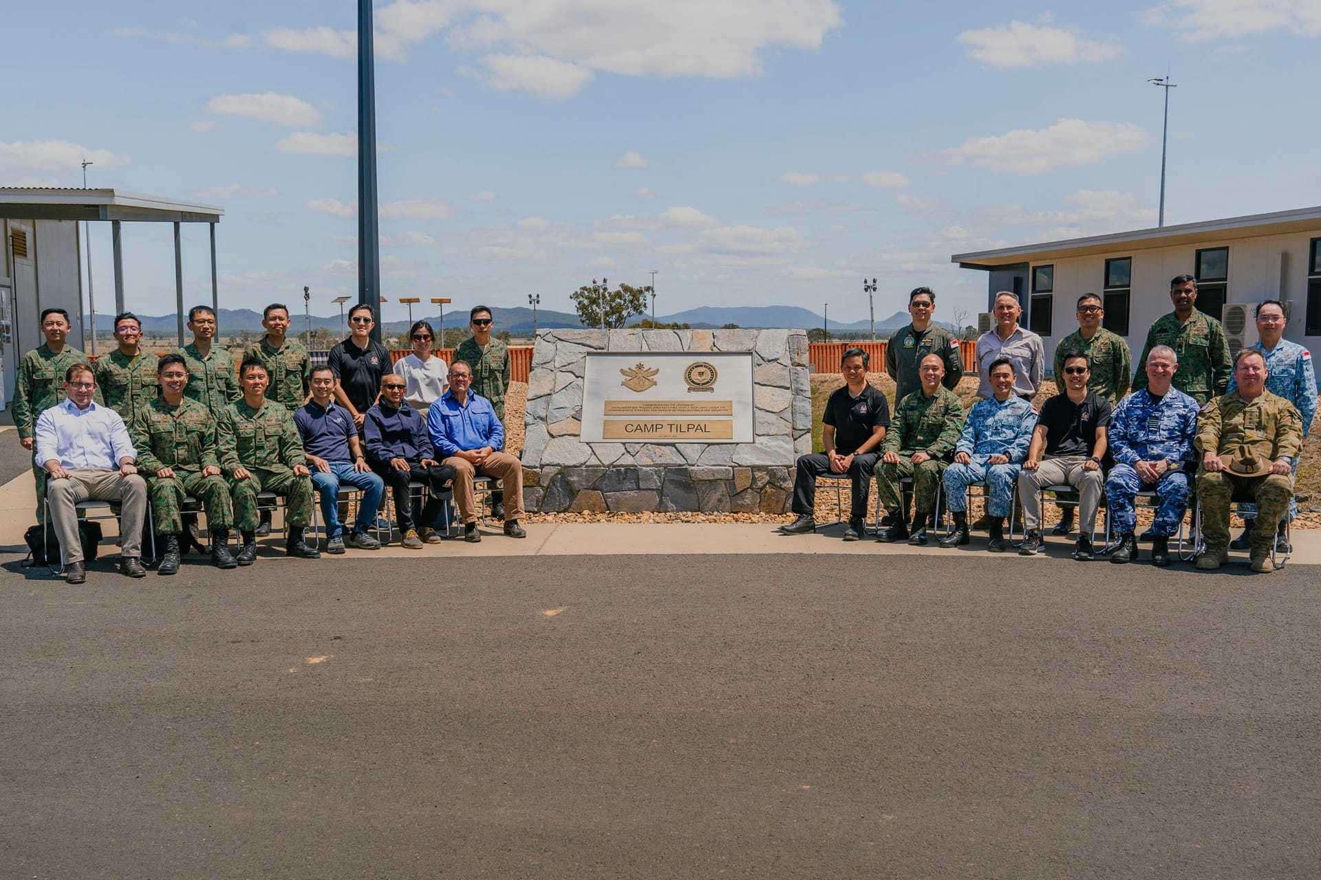 Group photo of Minister for Defence Mr Chan Chun Sing at the commemorative plinth in Camp Tilpal